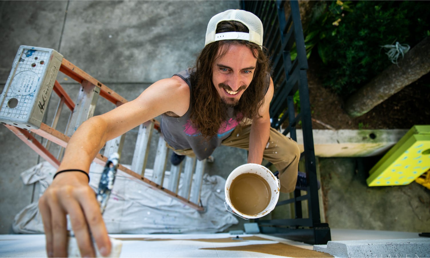 Photo of a painter painting a mural in Ocala, FL