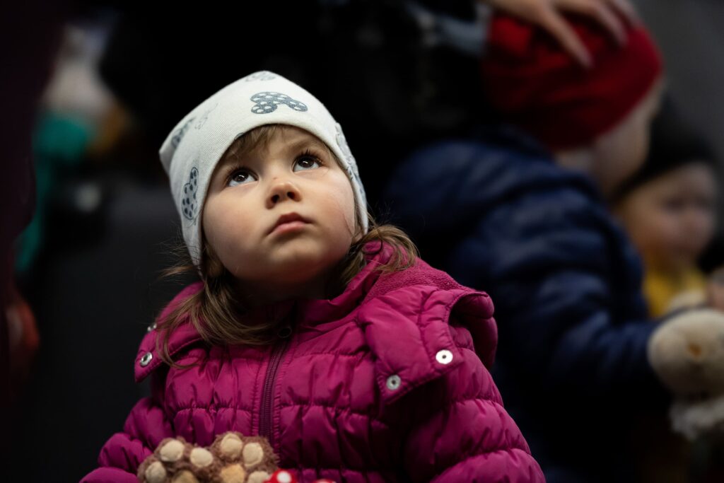 Polish girl looking up at non-profit event.