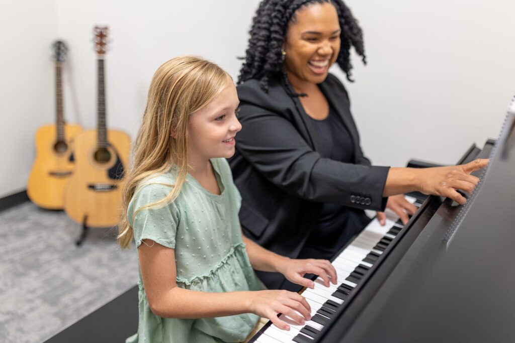 Piano teacher photographed teaching a student