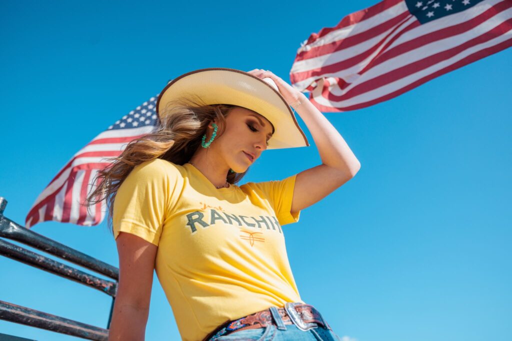Model, Olana, photographed showing off a t-shirt.