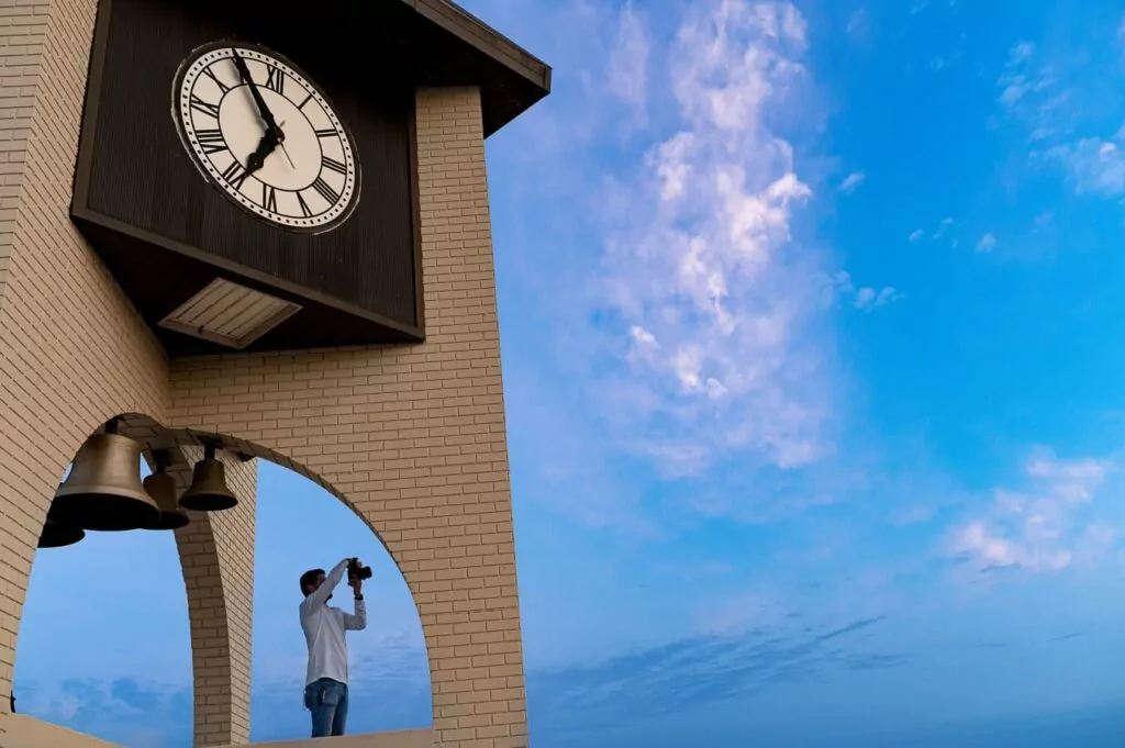 Team Maven photographing city from clocktower | Architecture + Spaces | Maven Photo and Film | Ocala, Florida