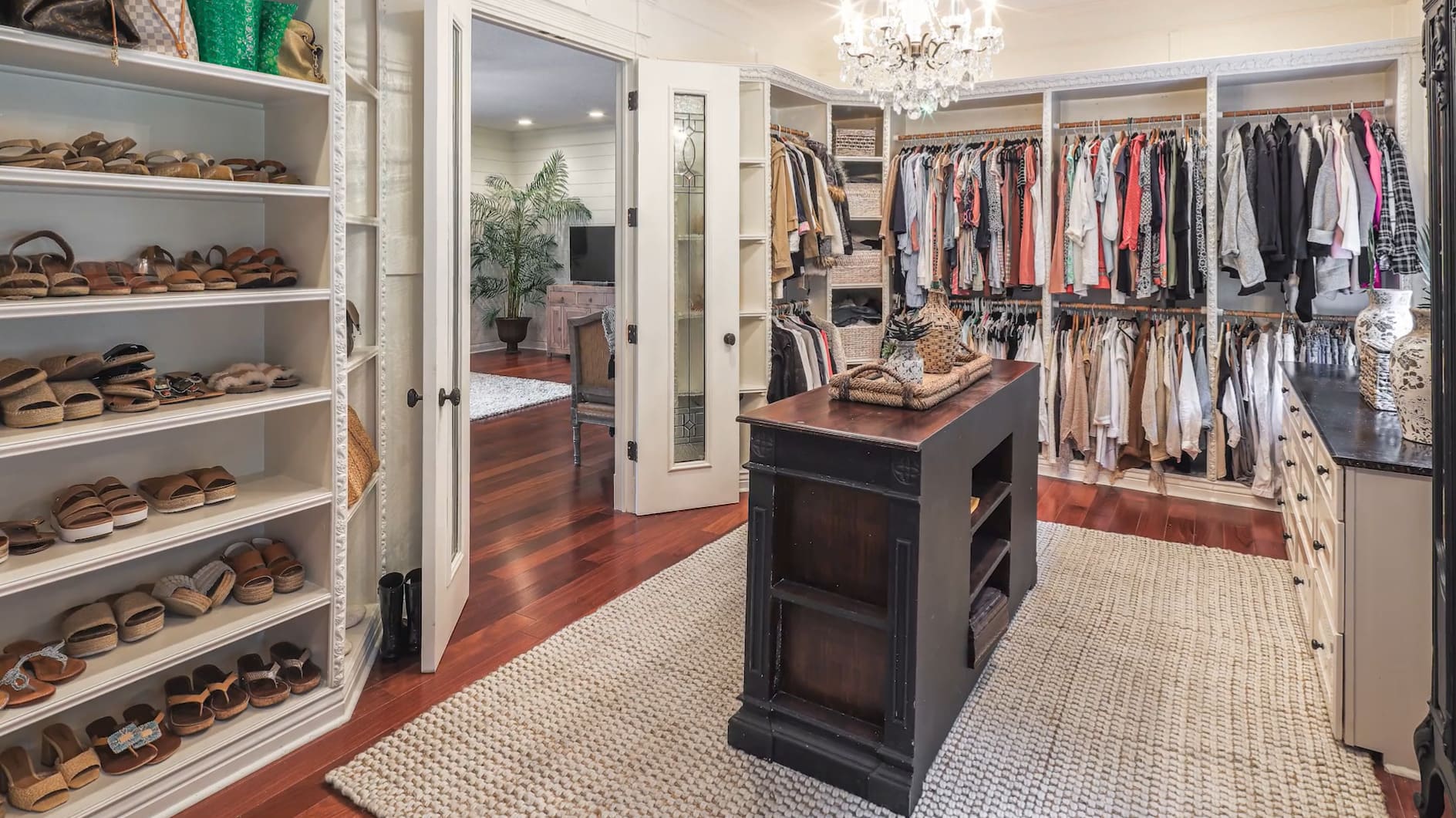 Still of a walk-in closet from the Front Gate Realty video for Stacey Rollins