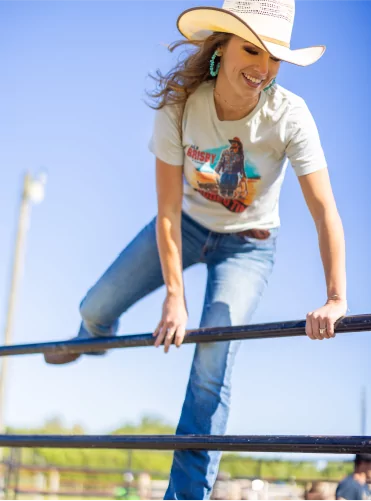 Picture of a model jumping a horse gate for a t-shirt campaign, photo taken by MAVEN Photo + Film