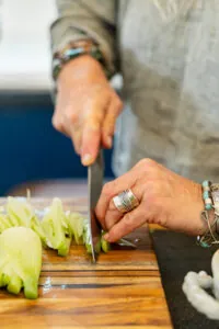 chopping vegetables on a cutting board
