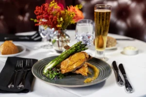 Golden entrée topped with asparagus at Mark’s Prime Steakhouse in Ocala