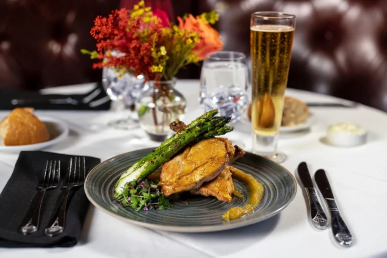 Golden entrée topped with asparagus at Mark’s Prime Steakhouse in Ocala